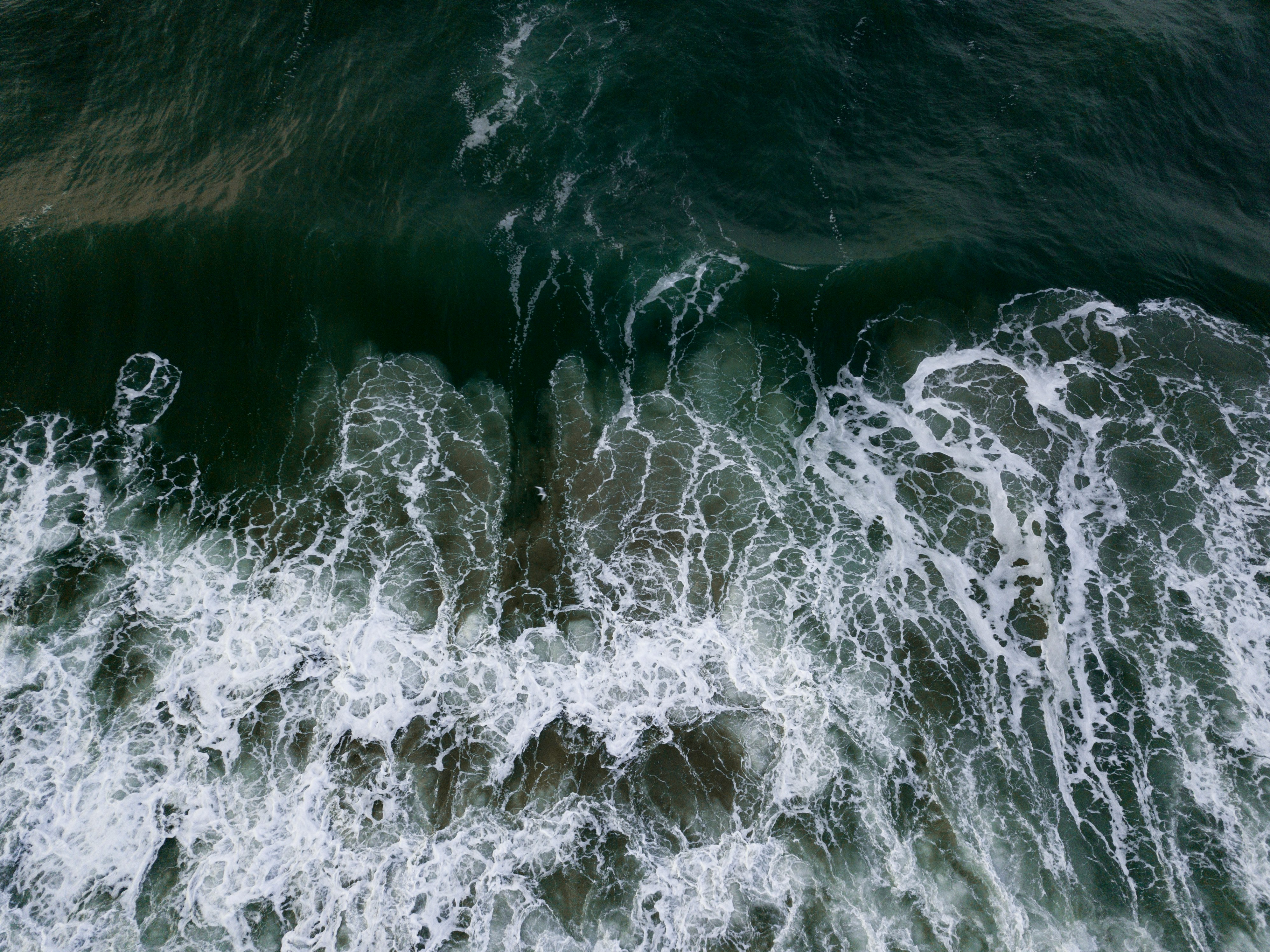 body of water with waves